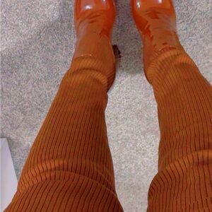 Vibrant Orange Ribbed Pants with Matching Boots